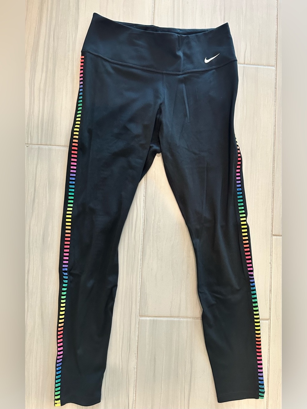 Women’s Size medium Nike Black Dri-Fit Leggings with Rainbow Side Stripes